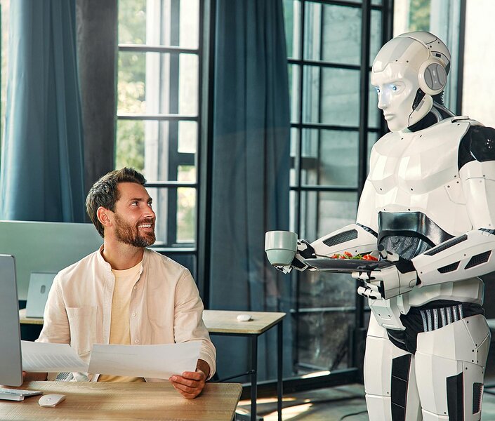 Ein KI-Roboter serviert einem Makler bei der Arbeit eine Tasse Kaffee